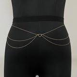 Black bra with gold accents on a light gray background