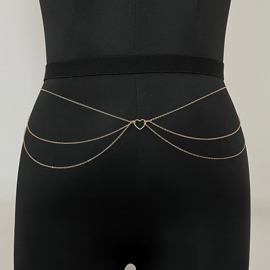 Black bra with gold accents on a light gray background